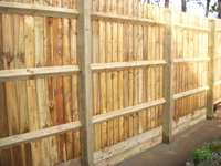 Close board fencing with wooden posts